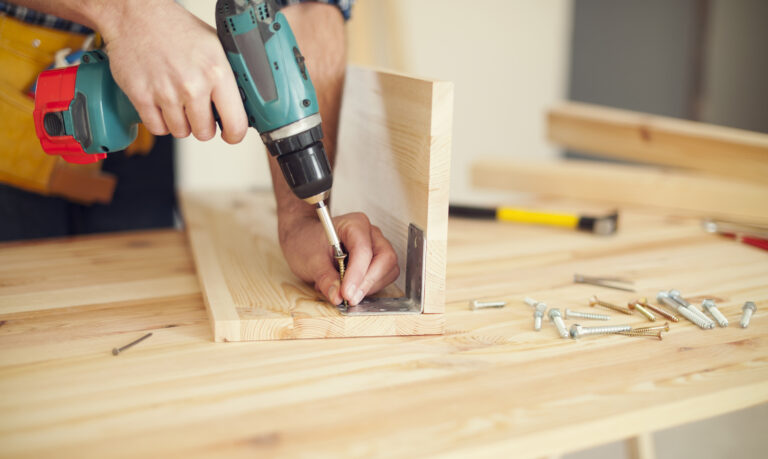 Close up of carpenter working with drill Close up of carpenter working with drill